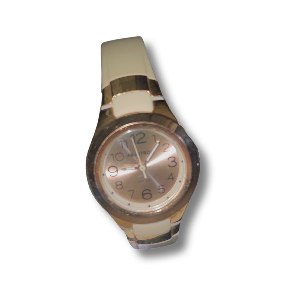 Rose gold watch with a cream colored strap by Armitron